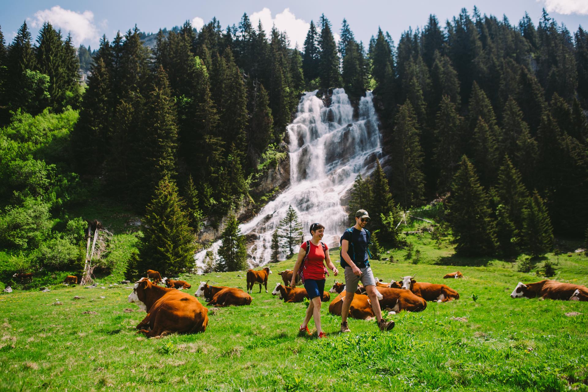 Couple walking through French Alps mountains in Morzine