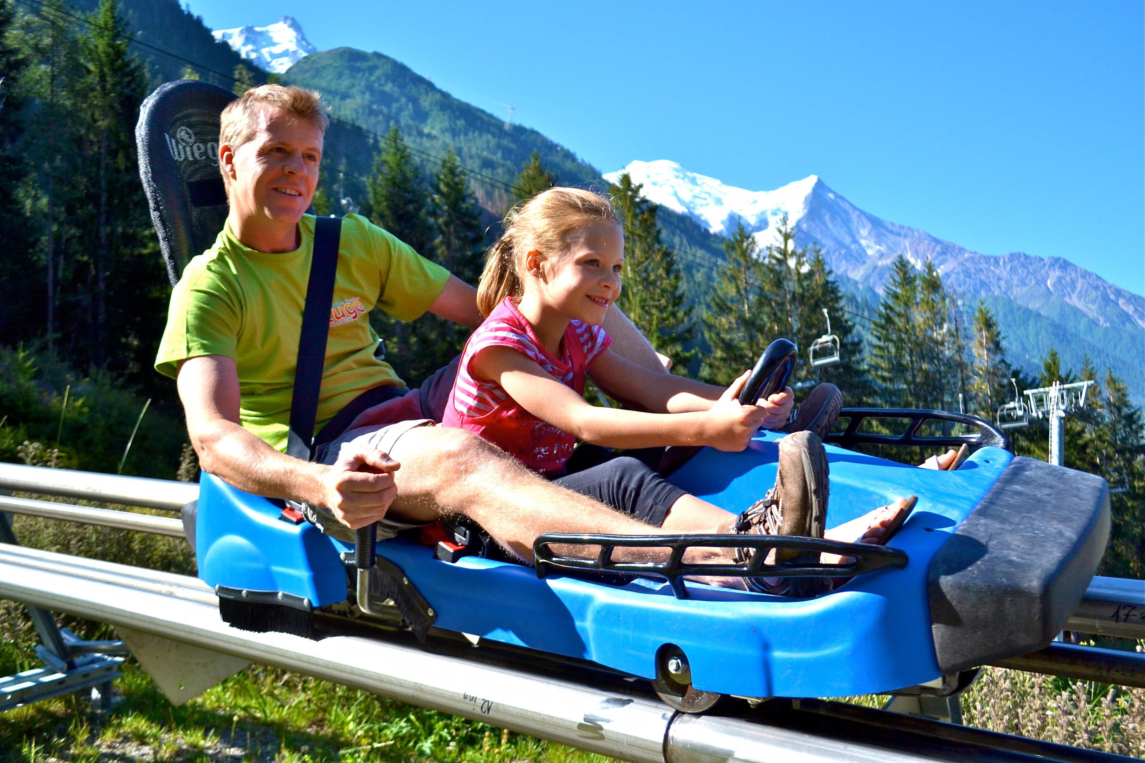 kids on a luge in summer